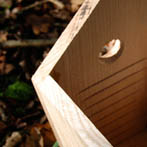 Inside detail of a BGO Bird Box showing drain holes and grooves to help the little fledgelings climb out.